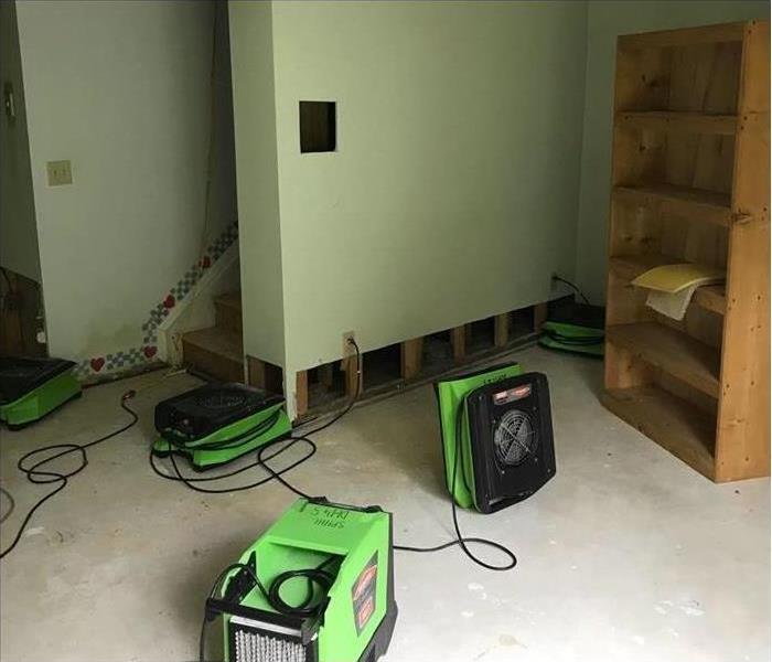 Green fans drying wet concrete and walls