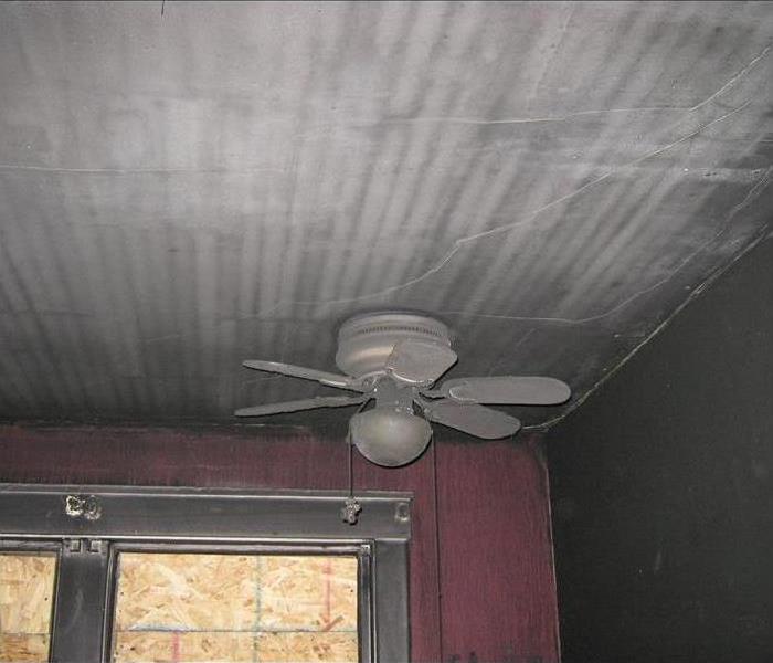 Soot covered ceiling fan 